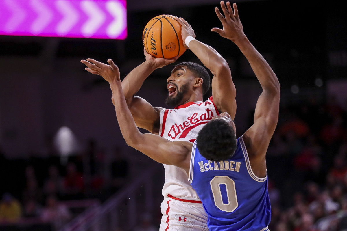 Jan 22, 2023; Cincinnati, Ohio, USA; Cincinnati Bearcats guard David DeJulius (5) plays the court against Memphis Tigers guard Elijah McCadden (0) in the first half at Fifth Third Arena. Mandatory Credit: Katie Stratman-USA TODAY Sports